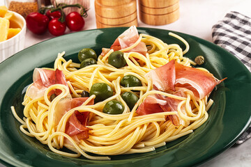 Pasta spaghetti with olives and jamon