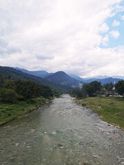 Winding River Through Rugged Mountains