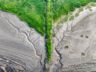 Tidal flat texture after low tide. Photographed at the mouth of the Qiantang River.