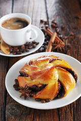 Bun with chocolate and coffee