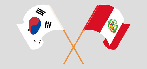 Crossed and waving flags of South Korea and Peru