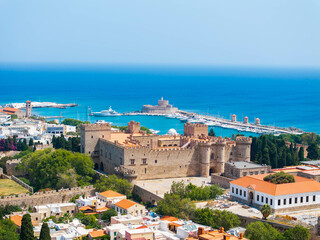 Palace of the Grand Master of the Knights of Rhodes with the blue sea and the old port in the background