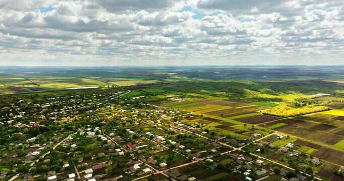 Aerial drone view of Pelinia, Drochia, Moldova with a cloudy sky