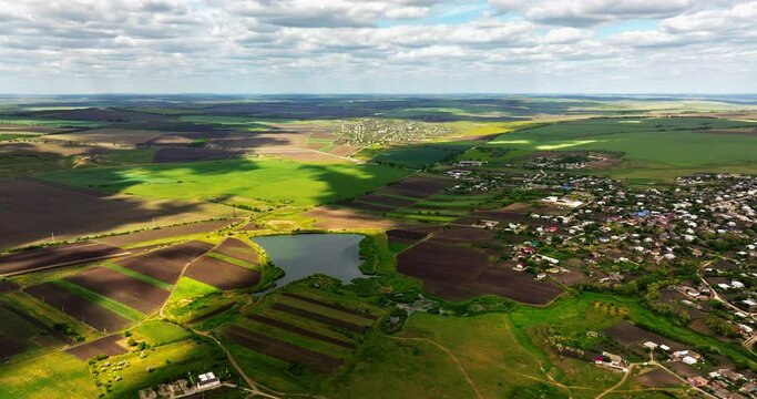 Aerial drone view of Pelinia, Drochia, Moldova with a cloudy sky