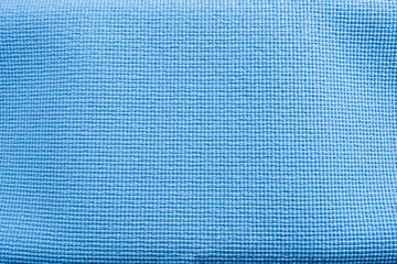 Blue fabric texture background with a grid pattern and light blue squares