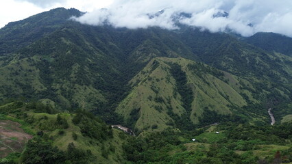 Aerial view, a mountain view with a little fog around it