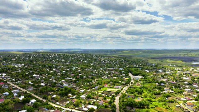 Aerial drone view of Pelinia, Drochia, Moldova with a cloudy sky
