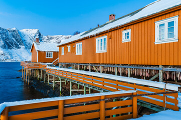 Wooden Dock With Yellow Building by Water