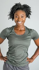 Fototapeta premium One African american black woman posing in sportswear, on white background, studio shoot.