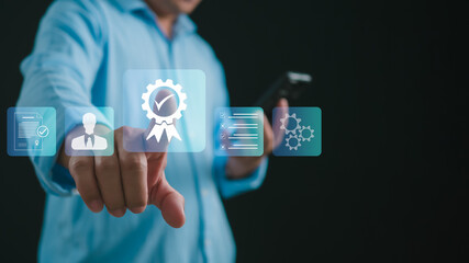 Man uses smartphone shows the sign of the top service the best Quality assurance, Standards, ISO certification and standardization concept. guarantee product and ISO service concept.