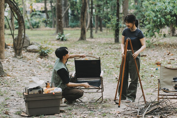 Asian couple sweet in tent inside on they camping trip, traveller relax and sleep togather in out...