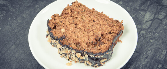 Pieces of zucchini dough with nuts and raisins