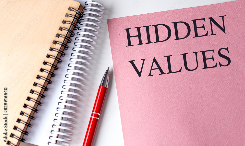 Poster hidden values text on pink paper with notebooks