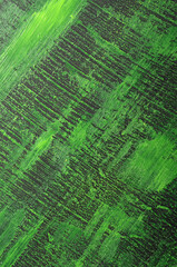 
art background in black with acid green stains