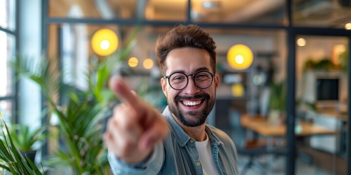 Businessman walks into office with thumbs up and success photo for support, yes or thank you. Happy individual at creative job with hands for like emoji celebrating winning, goals, or targets.