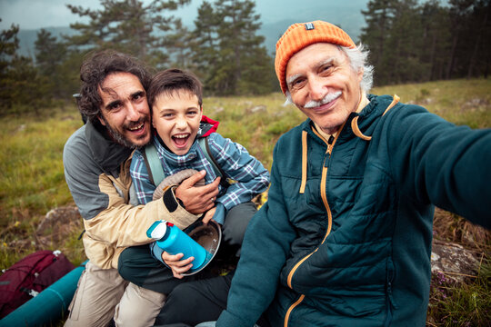 Three generation family selfie during hiking adventure in the mountains