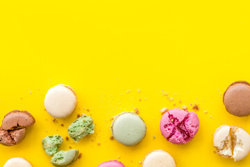 sweet dessert pattern with macarons on yellow background flat lay mockup