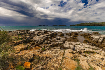 Landscape of the Croatian coast around Rovinj, rocky beaches, azure Adriatic Sea