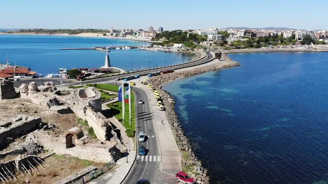 Aerial view of the marina with boats and yachts in old town of Nessebar, old church and houses, located in the Sunny Beach area of Bulgaria. Drone view from above. Summer holidays destination
