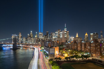 September 11 Tribute in Light with the skycrapers of Lower Manhattan at night. Elevated view of...