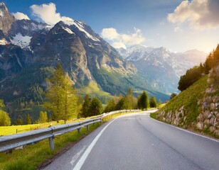 Obraz premium transport road in the Alps against the backdrop of snow-capped mountains and forest