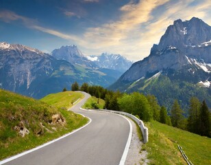 Fototapeta premium transport road in the Alps against the backdrop of snow-capped mountains and forest