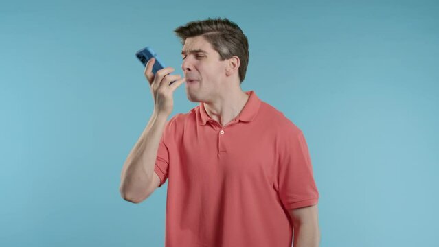 Angry handsome man quarreling, screaming talking on mobile phone. Guy in stress