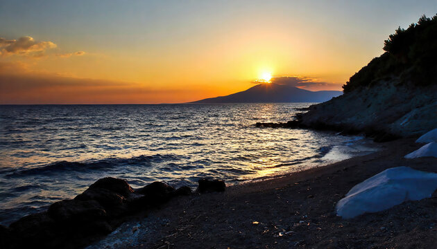 The stunning coastline and the silhouette of the island across the Aegean Sea at sunset