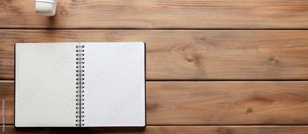 Aufkleber a laptop computer pen and supplies sit on a wooden office desk with a blank notebook this top view i