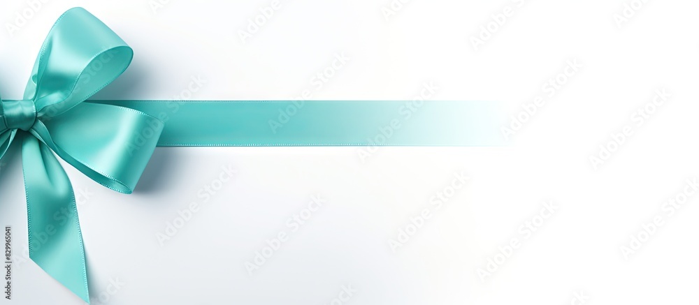 Poster copy space image of a white background adorned with a sleek satin gift bow in a beautiful aqua color