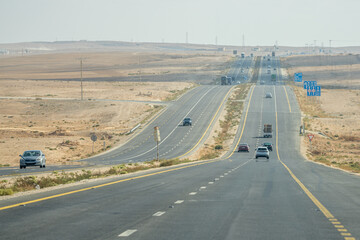 Vibrant Desert Highway in Jordan: Stunning Scenic View of a Bustling Roadway in the Arid Landscape