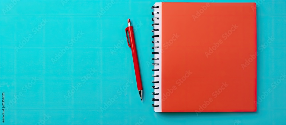 Leinwandbilder a copy space image of a notebook and pen resting on a vibrant color background