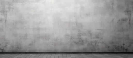 The cement wall with a grey paint has a copy space image
