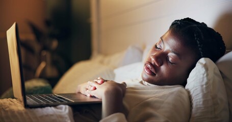 Woman, sleeping and laptop in bed at night streaming a movie, film or tired from remote work....
