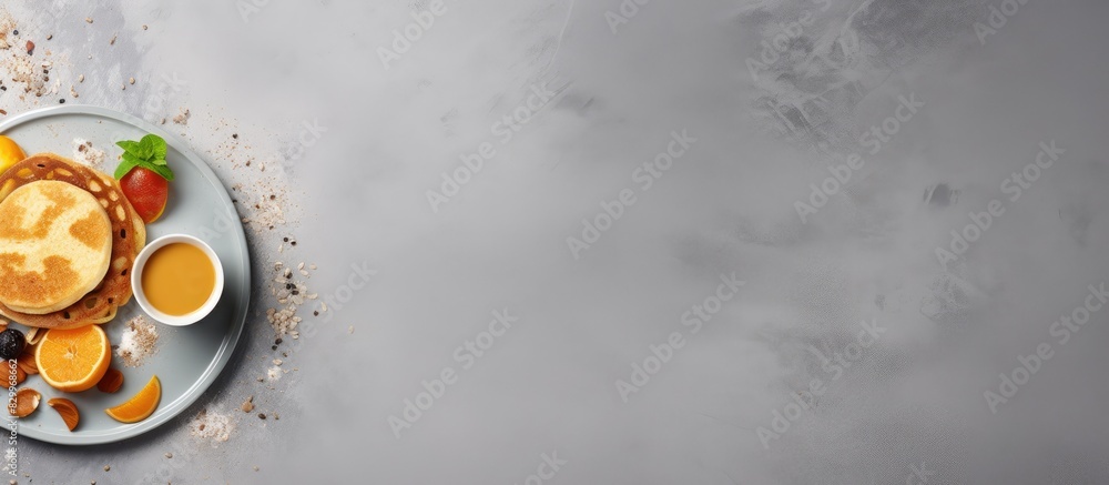 Poster On a gray cement background there is a trendy food and drink combination of mini pancake cereal and dalgona coffee The photo also features copy space for additional elements