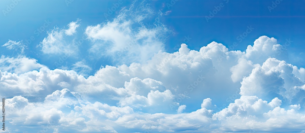 Poster a daylight sky with a composition of natural elements featuring a blue background with clouds perfec