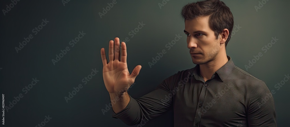 Poster Close up shot of a handsome man standing and extending his hand with copy space in the image