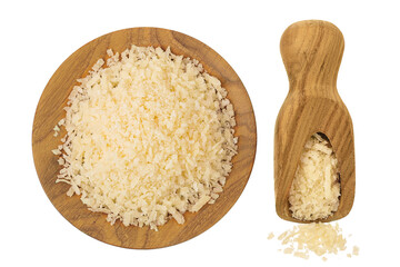 grated parmesan cheese in wooden bowl and scoop isolated on white background. Top view. Flat lay