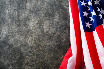 4th of July background. Empty gray concrete wall with American USA flag. National Flag Day. Happy...