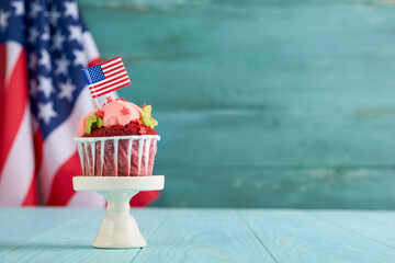 Patriotic cupcake 4th july with american flag. Delicious cupcake with cream cheese and blue and red...