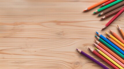 Fototapeta premium Vibrant colored pencils arranged on a wooden table, inviting creativity and inspiration