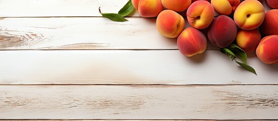 A copy space image of nectarines placed on a table made of white wood
