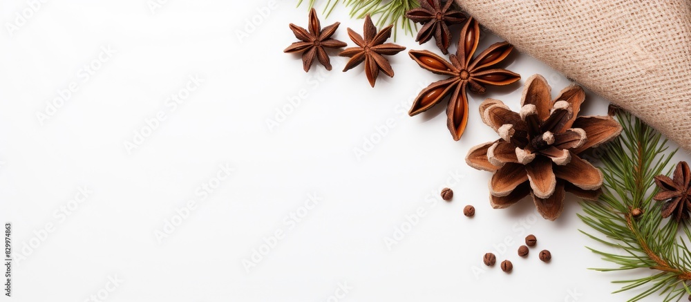 Poster a festive christmas and new year arrangement of fir branches with cones and star anise rests on a kn