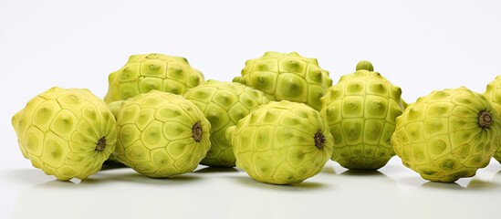 Fototapeta premium A copy space image of Noni fruits set against a white background standing out in isolation