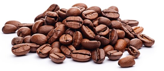 The macro image of isolated roasted coffee beans against a white background offers a textured backdrop with plenty of copy space for accompanying text