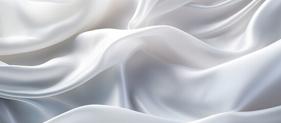 Fototapeta premium Luxurious white silk cloth with artistic curves and shiny animated waves creates a modern and abstract background It provides copy space perfect for decorating text or advertising purposes
