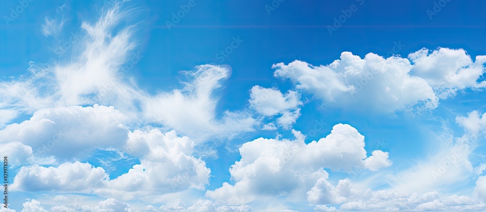 Poster descriptive blue sky with clouds forming an abstract background catering to copy space image