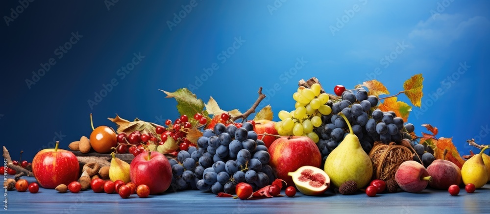 Poster a copy space image of an autumn themed still life with ripe fruits such as grapes red apples and fig