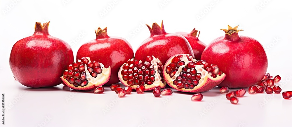 Poster copy space image of isolated pomegranate seeds on a white background