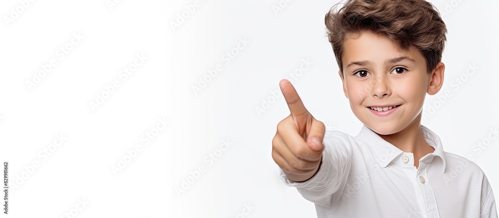 Poster cheerful boy pointing on white banner in a portrait isolated on a white background copy space image